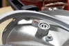 Close-up view of parts of a pressure cooker lid, including a gasket and valves. Produktbild-Vorschau