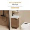 A small bathroom vanity with a sink and faucet, next to a toilet, with a shower visible on the left. Dimensions are shown. Voir les images du produit