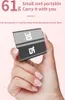 A hand holding a small, gray cube-shaped timer with numbers '30' and '15' visible. Podgląd zdjęcia produktu
