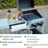 A barbecue grill with a side table holding condiments and a paper towel dispenser. Anteprima dell’immagine prodotto