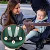 A woman is smiling at a baby in a stroller. The stroller has a green seat and a brown safety bar. A circular inset highlights the stroller's harness system with numbered points. Produktbild-Vorschau