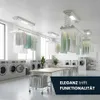A modern laundry room with multiple washing machines, drying racks, and tables. Clothes are hanging on ceiling-mounted drying racks. Produktbild-Vorschau
