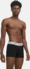 A man wearing black boxer shorts with a white waistband. Podgląd zdjęcia produktu
