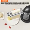 A pasta maker attachment for a stand mixer is shown in use, making fresh pasta. There are also some uncooked noodles and cherry tomatoes in the foreground. Produktbild-Vorschau