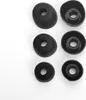 Six black earbud tips are arranged in two columns on a white background. Produktbild-Vorschau