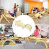 A collage of images showing children playing on wooden climbing structures indoors and outdoors. Produktbild-Vorschau