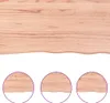 A close-up view of a light brown wooden shelf with a wavy edge, shown against a white background. Three circular insets at the bottom show magnified views of the shelf's edge. Náhled obrázku produktu