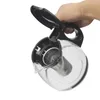 A hand is holding the lid of a glass teapot with a built-in infuser. Náhled obrázku produktu
