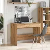 A home office setup with a wooden desk, laptop, chair, and bookshelf. Anteprima dell’immagine prodotto