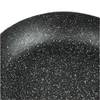 A close-up view of the speckled surface of a black frying pan. Náhľad obrázku produktu