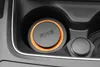 A close-up view of an Axe car air freshener placed in a car's cup holder. Anteprima dell’immagine prodotto