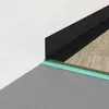 Close-up view of flooring installation materials at a wall corner. Anteprima dell’immagine prodotto