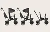 Three black tricycles are displayed side-by-side against a plain background, showcasing different configurations or stages of assembly. Produktbild-Vorschau