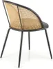 A side view of a chair with a black metal frame and a woven cane back and seat. Podgląd zdjęcia produktu