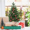A decorated mini Christmas tree with gifts and festive decorations. Produktbild-Vorschau