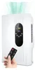 A hand holds a remote control in front of a white dehumidifier and air purifier. Produktbild-Vorschau