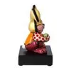 A side view of a colorful figurine of a rabbit sitting on a black base. Produktbild-Vorschau