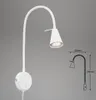 A white LED wall lamp with a flexible arm is shown against a plain gray background. A technical drawing with dimensions is also present on the right side. Náhľad obrázku produktu