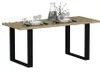 A dining table set with plates, glasses, and a vase. Produktbild-Vorschau