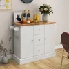 A white kitchen island with a wooden countertop is shown in a room setting. Náhled obrázku produktu