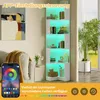 A corner bookshelf with LED lighting, shown in a living room setting with a couch and a plant. Voir les images du produit