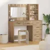 A wooden dressing table with a mirror and shelves, a stool in front, and a plant to the side. Voir les images du produit
