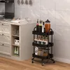 A kitchen scene with a rolling cart filled with kitchen items. Produktbild-Vorschau
