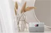 A modern radio sits on a shelf next to a vase of dried pampas grass, with sheer curtains in the foreground and a large circular mirror in the background. Anteprima dell’immagine prodotto