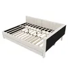 A bed frame with a slatted base, shown from a diagonal angle against a white background. Podgląd zdjęcia produktu