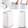 A collage of images showing a white dehumidifier, including close-ups of its features and a full product shot. Anteprima dell’immagine prodotto