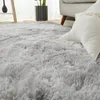 A close-up view of a fluffy, gray shaggy rug. Náhled obrázku produktu