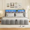 A bed with a headboard featuring LED lighting and storage compartments. Produktbild-Vorschau