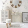 A bedroom or dressing room setting with a vanity, chest of drawers, mirror, and stool. Podgląd zdjęcia produktu