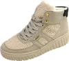 A single beige Rieker boot is shown against a white background. Voir les images du produit