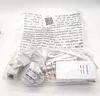 A clear plastic bag containing various electronic accessories, including power adapters and a white control box labeled 'DoorBird'. Anteprima dell’immagine prodotto