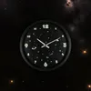 A clock with a space theme is shown against a background of stars and nebulae. Náhled obrázku produktu