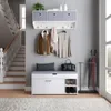 An entryway hallway with a shoe bench, coat rack, and stairs. Voir les images du produit
