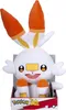 A plush toy of the Pokemon character Scorbunny is displayed in its packaging. Voir les images du produit