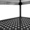 A close-up view of a black perforated shelf on a metal stand. Produktbild-Vorschau
