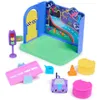 A toy playset with various accessories, including a small car, traffic light, and road pieces, arranged on a white background. Náhľad obrázku produktu