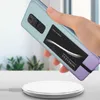 A hand holding a phone with a wireless charging receiver attached, hovering over a wireless charging pad. Náhľad obrázku produktu