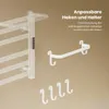 A white towel warmer with attached hooks and a towel bar, presented against a light brown background with descriptive text. Anteprima dell’immagine prodotto