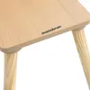 A close-up view of a wooden table with the brand name 'mamabrum' printed on it, and wooden legs. Produktbild-Vorschau