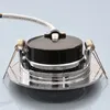 The back of a recessed LED spotlight with mounting springs and a wire connector. Produktbild-Vorschau