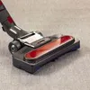A close-up of a vacuum cleaner head on a carpet. Náhled obrázku produktu