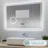 A bathroom mirror with LED lighting and a digital display is shown above a sink. Produktbild-Vorschau