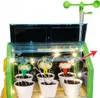 A mini greenhouse with seedlings, lights, and weather instruments. Podgląd zdjęcia produktu