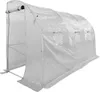 A white tunnel greenhouse with a metal frame and a transparent plastic cover.
