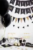 A New Year's Eve party setup with balloons, banners, cake pops, and champagne. Podgląd zdjęcia produktu