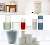 A collage of kitchen canisters and a planter. Anteprima dell’immagine prodotto